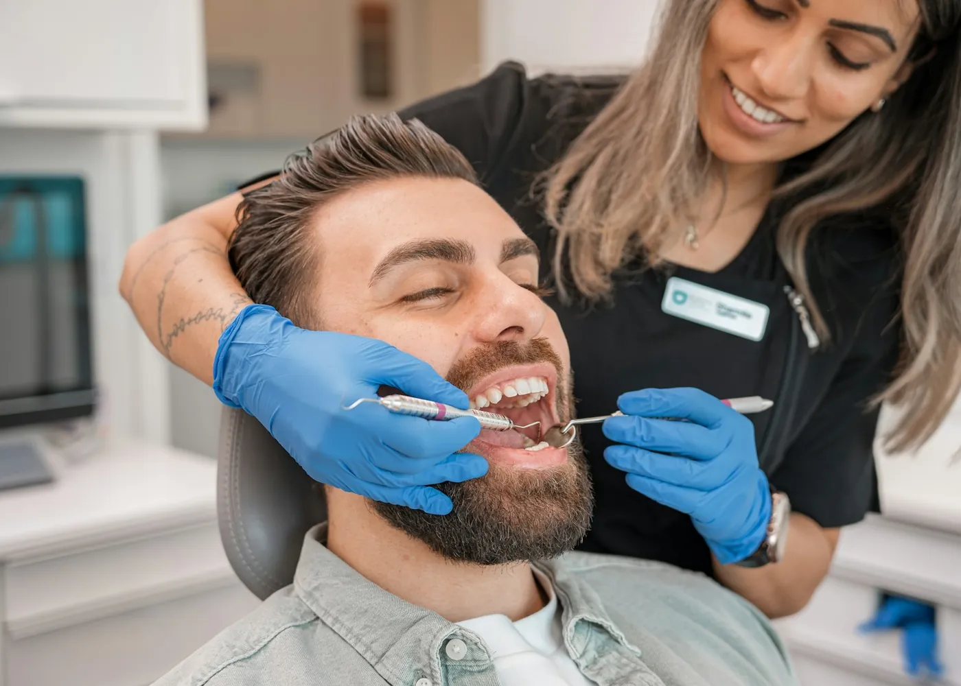 A dentist examining a patient's teeth